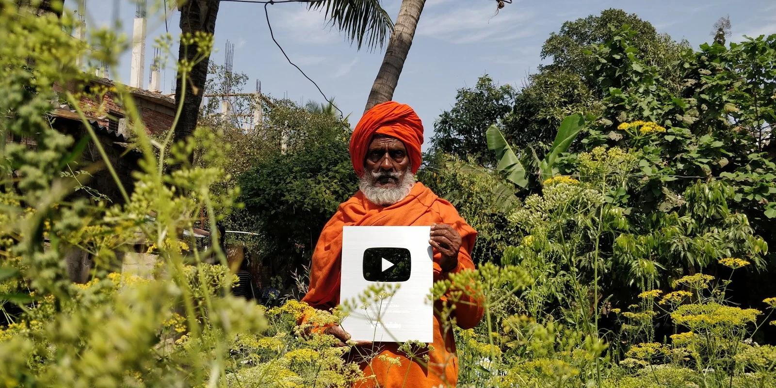 Green plants and trees in Shyam Sadhu's garden.